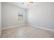 Inviting bedroom with tiled flooring and a window with backyard views at 19724 Post Island Loop, Land O Lakes, FL 34638