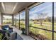 Relax on the screened lanai with scenic views of the backyard and pond at 19724 Post Island Loop, Land O Lakes, FL 34638