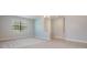 A spacious living room featuring neutral walls, and a large window providing natural light at 19724 Post Island Loop, Land O Lakes, FL 34638