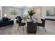 Bright living room features modern furnishings, stylish decor, and lots of natural light at 19724 Post Island Loop, Land O Lakes, FL 34638