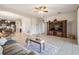 Open concept living room and kitchen with tile floors and neutral paint at 19724 Post Island Loop, Land O Lakes, FL 34638