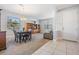 Bright open living space featuring dining area, built-in shelving and columns at 19724 Post Island Loop, Land O Lakes, FL 34638