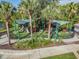 Community playground with colorful equipment and a safety surface, providing a fun and secure environment for children at 19724 Post Island Loop, Land O Lakes, FL 34638