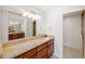Elegant bathroom featuring granite countertops and a large mirror at 301 Cordova Grn, Seminole, FL 33777