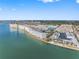 Expansive aerial view of waterfront condos and a marina on a sunny day with blue sky and sea at 3010 59Th S St # 304, Gulfport, FL 33707
