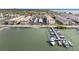 Aerial view of waterfront condos, boat docks, and city skyline at 3010 59Th S St # 304, Gulfport, FL 33707
