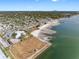 Beautiful Gulfport, Florida, aerial view highlighting the coastline, pier, and distant city skyline on a sunny day at 3010 59Th S St # 304, Gulfport, FL 33707