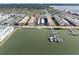 Aerial view of waterfront condos, boat docks, and city skyline at 3010 59Th S St # 304, Gulfport, FL 33707