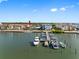 Aerial view of a dock and boats near multi-story buildings and water at 3010 59Th S St # 304, Gulfport, FL 33707
