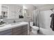 Well-lit bathroom featuring a modern vanity, tub, and shower combination at 3010 59Th S St # 304, Gulfport, FL 33707