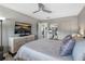 Comfortable bedroom with TV, a queen bed with light colored bedding, and a light colored dresser at 3010 59Th S St # 304, Gulfport, FL 33707