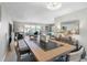 An open concept living space with a dining room that leads to a bright living room at 3010 59Th S St # 304, Gulfport, FL 33707