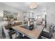 Dining room featuring modern lighting and view into the kitchen at 3010 59Th S St # 304, Gulfport, FL 33707