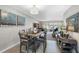 A dining room adjacent to the living room, features an elegant light fixture and modern decor at 3010 59Th S St # 304, Gulfport, FL 33707
