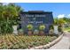 Community entrance sign featuring flowers and landscaping at 3010 59Th S St # 304, Gulfport, FL 33707