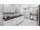 Bright kitchen featuring white cabinets, stainless steel appliances, and a modern design at 3010 59Th S St # 304, Gulfport, FL 33707