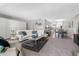Spacious living room with ample seating, neutral tones, and an open floor plan leading to dining at 3010 59Th S St # 304, Gulfport, FL 33707