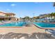 Outdoor pool with brick paver deck, lots of chairs, landscaping, and multi-story buildings in the background at 3010 59Th S St # 304, Gulfport, FL 33707