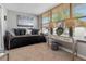 Relaxing sunroom with a daybed, modern decor, and large windows overlooking the neighborhood at 3010 59Th S St # 304, Gulfport, FL 33707