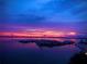 A serene harbor with yachts under a stunning sunset sky, creating a tranquil waterfront scene at 3010 59Th S St # 304, Gulfport, FL 33707
