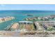 Aerial view featuring waterfront condos and tennis courts at 363 Pinellas Bayway S # 41, Tierra Verde, FL 33715