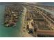 Breathtaking aerial view of waterfront homes and condos with boat docks along the tranquil waterway at 363 Pinellas Bayway S # 41, Tierra Verde, FL 33715