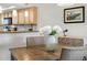 Charming dining area with modern décor, adjacent to the kitchen, perfect for entertaining guests at 363 Pinellas Bayway S # 41, Tierra Verde, FL 33715