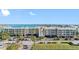 Bayfront condos with palm trees, landscaping, and waterfront views at 363 Pinellas Bayway S # 41, Tierra Verde, FL 33715