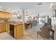 Bright and airy living room seamlessly connected to a modern kitchen and dining area with a sliding door to the terrace at 363 Pinellas Bayway S # 41, Tierra Verde, FL 33715