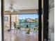 Outdoor patio seating area with waterfront views and a ceiling fan for added comfort at 363 Pinellas Bayway S # 41, Tierra Verde, FL 33715