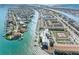 Scenic aerial view highlighting waterfront condos, a pool, community tennis courts, and boat docks for premier living at 363 Pinellas Bayway S # 41, Tierra Verde, FL 33715