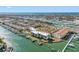 Gorgeous aerial view of waterfront condos offering a pool, tennis courts, boat docks, and amazing waterfront access at 363 Pinellas Bayway S # 41, Tierra Verde, FL 33715