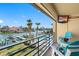 Inviting balcony with waterfront views, comfortable seating, and an outdoor entertainment area at 363 Pinellas Bayway S # 41, Tierra Verde, FL 33715