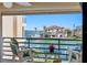 Serene balcony with seating offering captivating views of the waterfront and nearby homes at 363 Pinellas Bayway S # 41, Tierra Verde, FL 33715