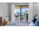 Bedroom featuring access to a tranquil balcony with stunning waterfront scenery at 363 Pinellas Bayway S # 41, Tierra Verde, FL 33715