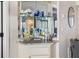 Elegant bar area with shelving and decorative touches at 363 Pinellas Bayway S # 41, Tierra Verde, FL 33715