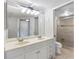 Bright bathroom with double vanity, updated fixtures, and a glass-enclosed shower at 363 Pinellas Bayway S # 41, Tierra Verde, FL 33715