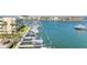 Exterior view of condos highlighting boat docks, lush landscaping, and convenient waterfront access at 363 Pinellas Bayway S # 41, Tierra Verde, FL 33715