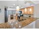 Well-equipped kitchen with granite countertops, stainless steel appliances, and ample cabinet space at 363 Pinellas Bayway S # 41, Tierra Verde, FL 33715
