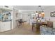 Open-concept living area with seamless transition to the dining and kitchen spaces, enhancing the home's flow at 363 Pinellas Bayway S # 41, Tierra Verde, FL 33715