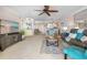 Open-concept living area with a bar, view into the kitchen, and stylish decor at 363 Pinellas Bayway S # 41, Tierra Verde, FL 33715