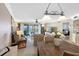 Spacious and inviting living space features a dining area, stylish furnishings, and scenic water views at 363 Pinellas Bayway S # 41, Tierra Verde, FL 33715