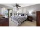 Comfortable main bedroom with ceiling fan leads to balcony overlooking a gorgeous water view at 363 Pinellas Bayway S # 41, Tierra Verde, FL 33715