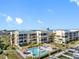 Exterior showcasing condos, community pool, lush landscaping, and boat docks for premier waterfront living at 363 Pinellas Bayway S # 41, Tierra Verde, FL 33715