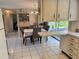 Modern kitchen and dining space, seamlessly connected with garden views, creating a warm atmosphere at 3722 Haven Dr, New Port Richey, FL 34652