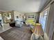 Inviting living room featuring cozy seating, art, and natural light from the window at 3722 Haven Dr, New Port Richey, FL 34652