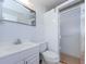Bathroom with tiled shower, glass door, and sleek fixtures at 4154 57Th N St # 173, Kenneth City, FL 33709