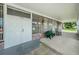Clubhouse entrance features double doors, covered porch with seating, and brick accents at 4154 57Th N St # 173, Kenneth City, FL 33709
