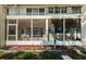 Screened patio close-up with a ceiling fan and lush greenery at 4154 57Th N St # 173, Kenneth City, FL 33709