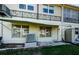 Exterior of condo featuring awning, door, wrought iron, and air conditioning unit at 4154 57Th N St # 173, Kenneth City, FL 33709